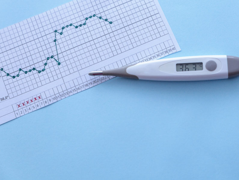 fertility awareness chart with basal body temperature thermometer