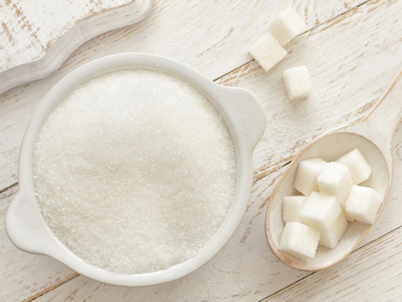 bowl of sugar and sugar cubes on a table one of many inflammatory foods