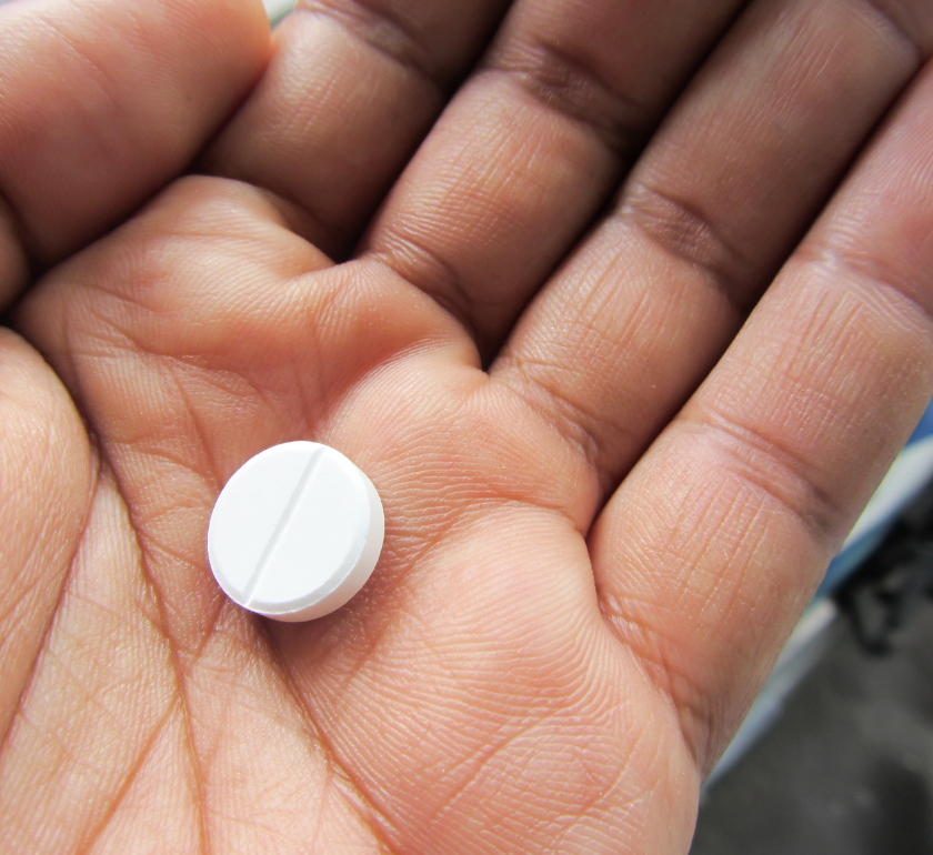mood stabilizer pill in a person's hand