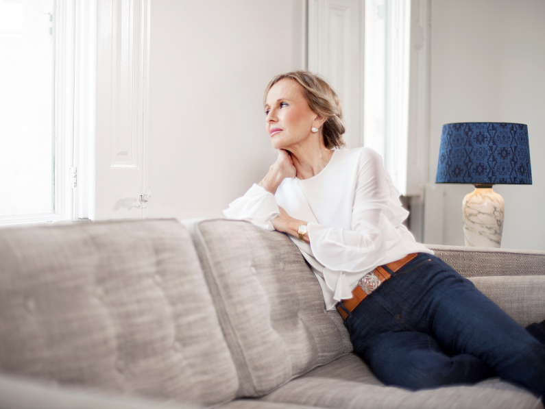 <img src= "woman sitting on couch.png" alt="childfree woman sitting on couch thinking"/>