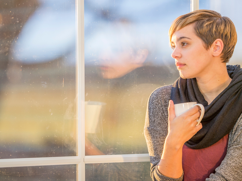 a woman enjoying a cup of tea during her mental health break